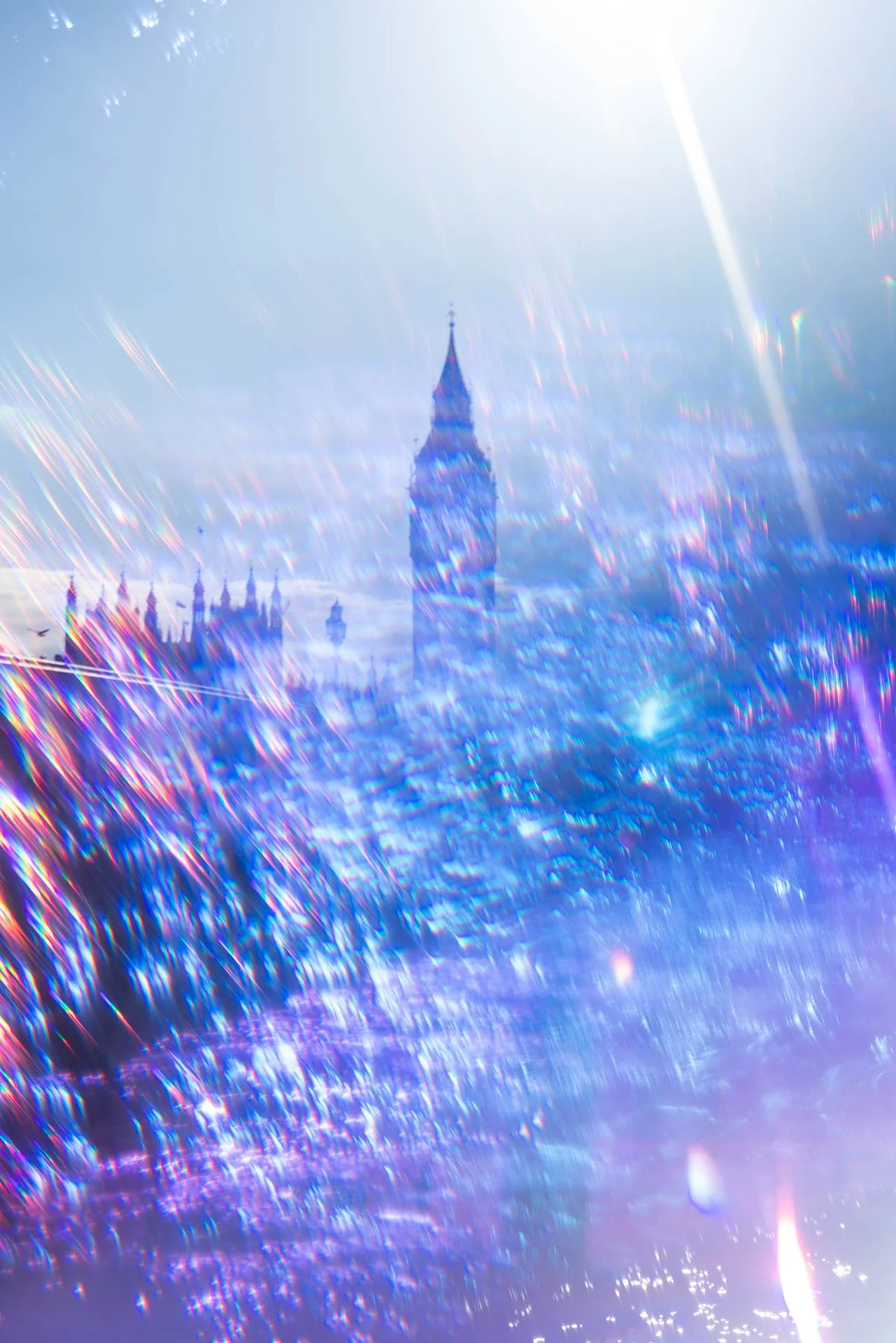 Blurred image of a tower with prism rainbow effects