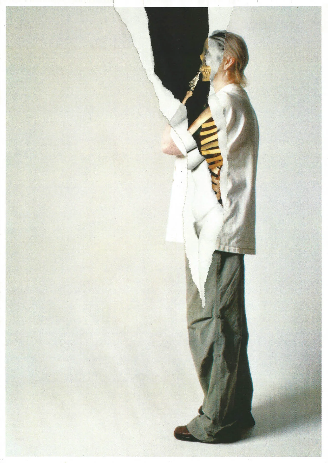 Person in torn clothes revealing a skeleton inside