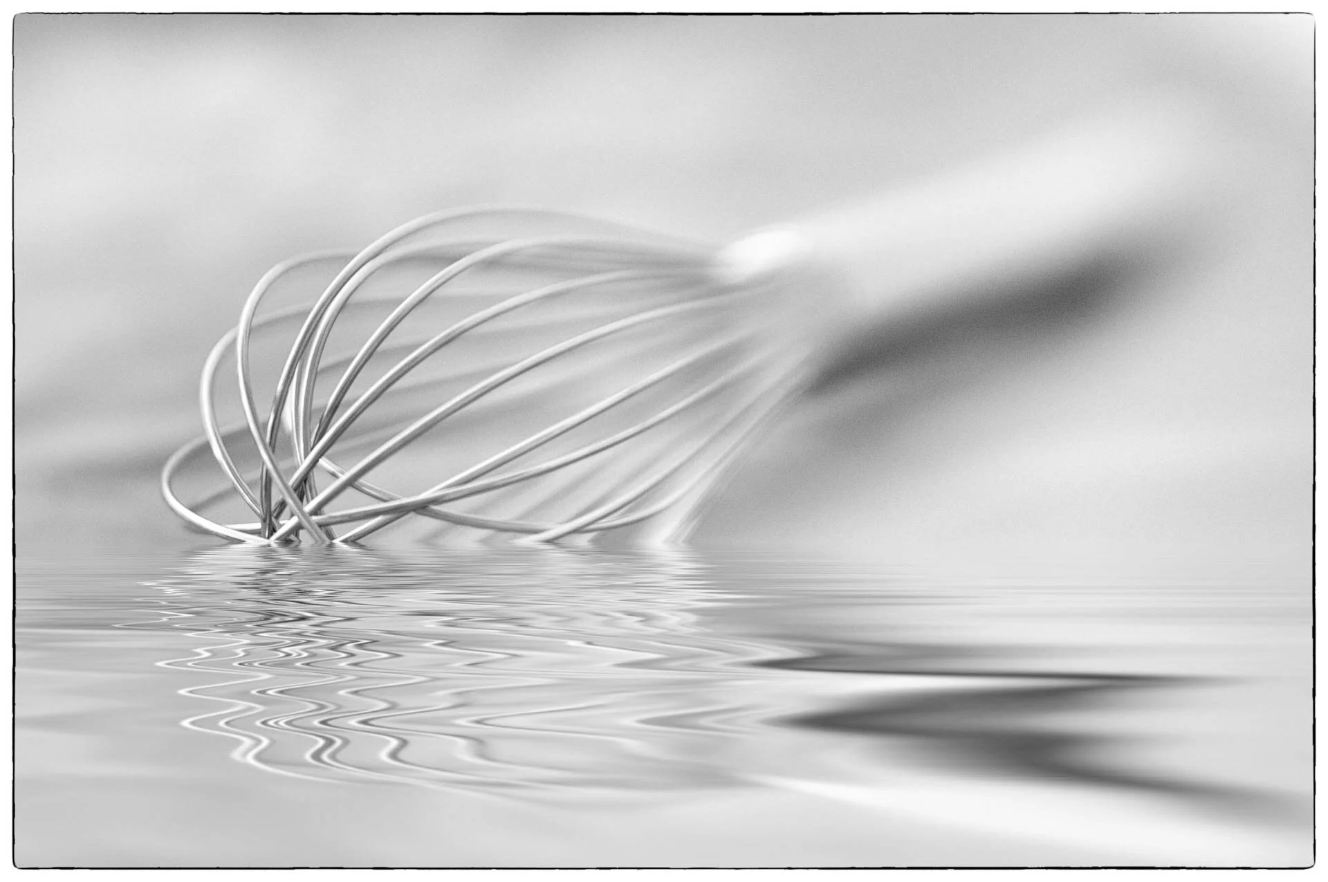 Close-up of a whisk submerged in water with a reflective rippled surface.
