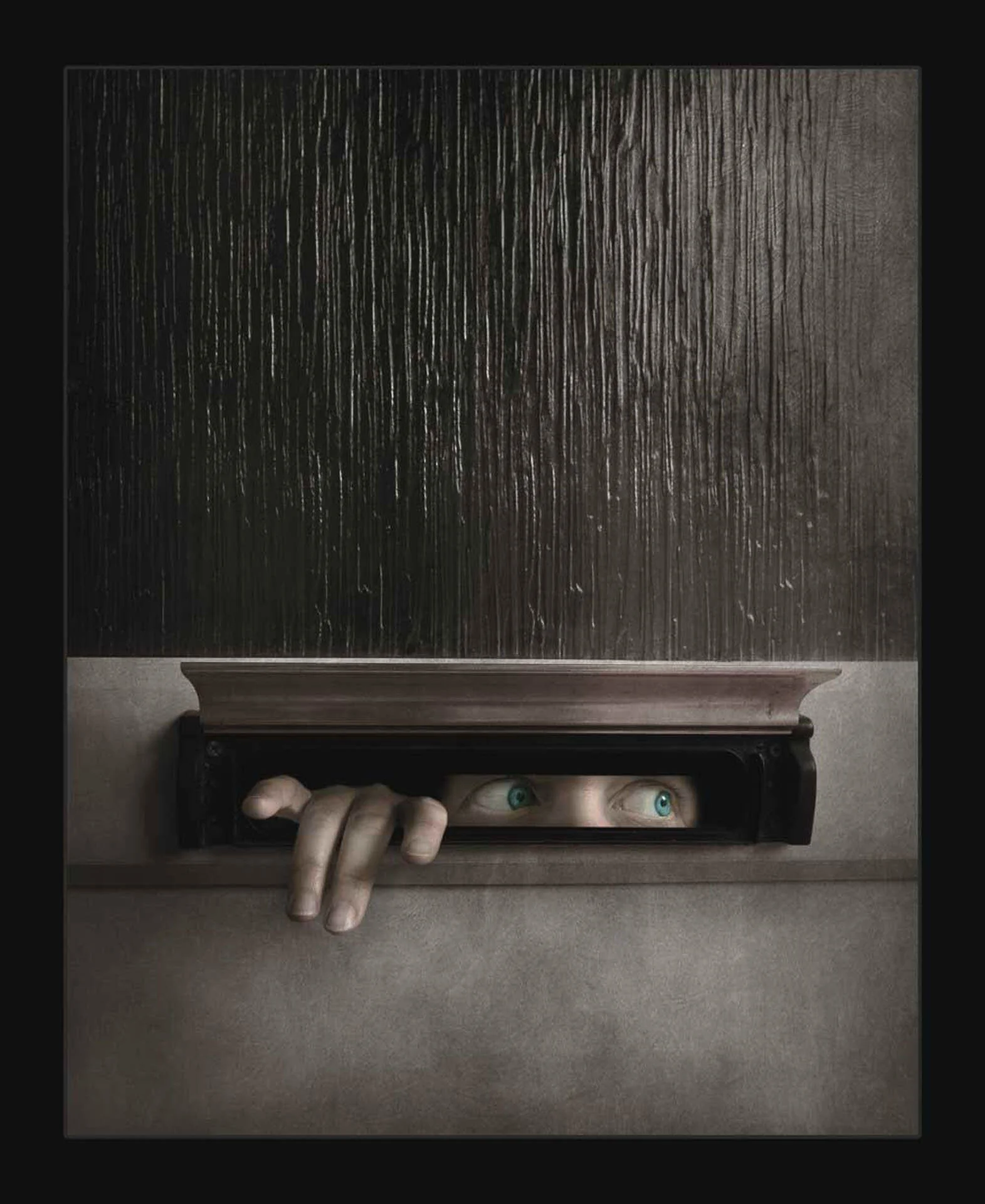 A close-up image of a person's hand and eyes peeking through a mail slot in a wooden door.