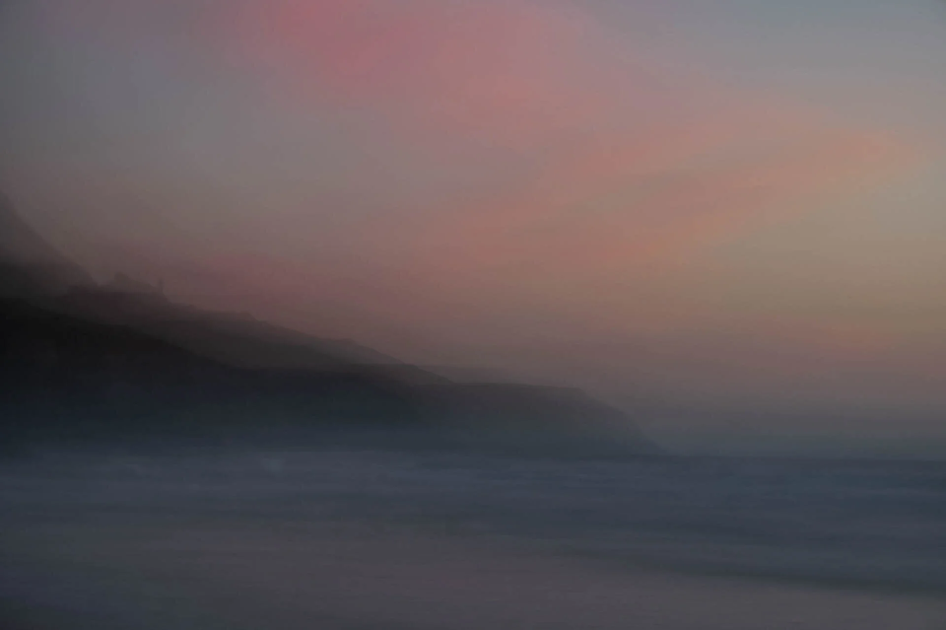 Abstract landscape with blurred hills and sky at sunset