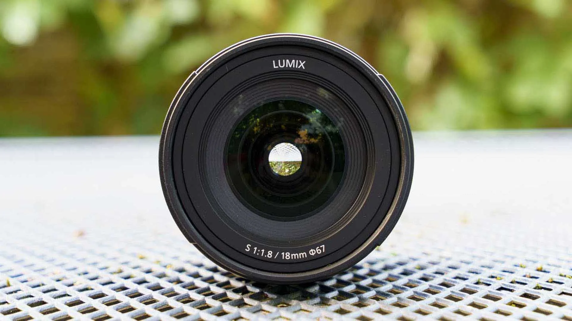  The iris blades inside a lens close to form an aperture through which light passes. The size of the aperture determines how much light passes through the lens to the film or sensor.  