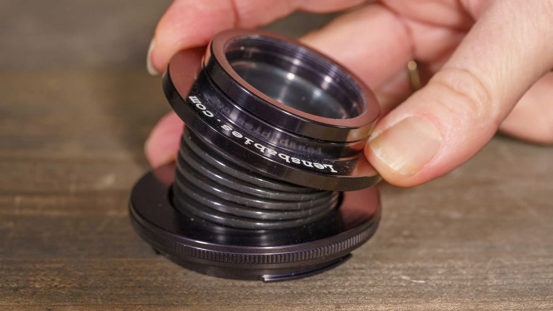  The original Lensbaby was a very simple lens with a bendy barrel and a fixed optic. There were washers (also called stops) that could be placed on the optic to set the aperture. 