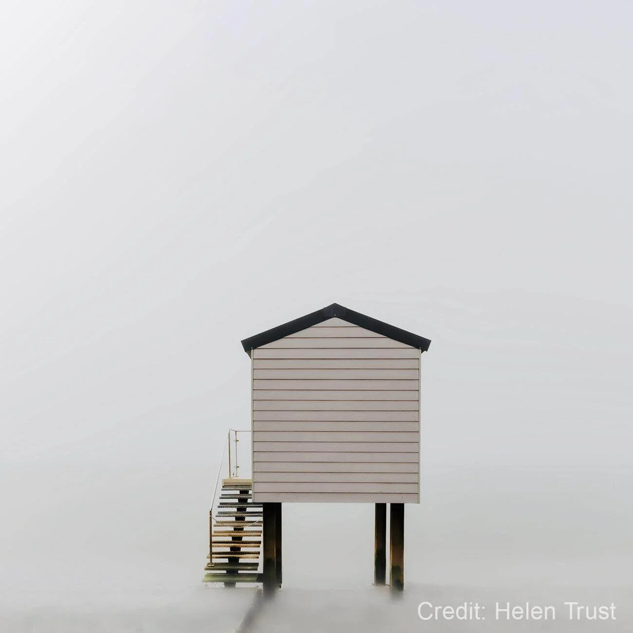 Triangular piece of ice surrounded by flowing water